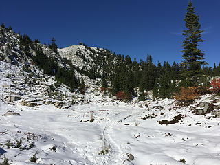 Snowy basin. Lookout can be seen ahead.