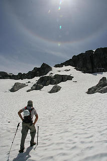 Adam looks up the snowfield towards the summit