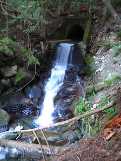 Man-made waterfall pouring out from beneath the old roadbed at 1750 ft