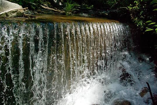 Wooden culvert waterfall