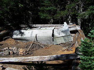 Campsite using old B-17 wreckage for a lean-to.
