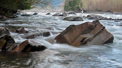 Carbon River flowing around some rocks. Foothills Trail, WA