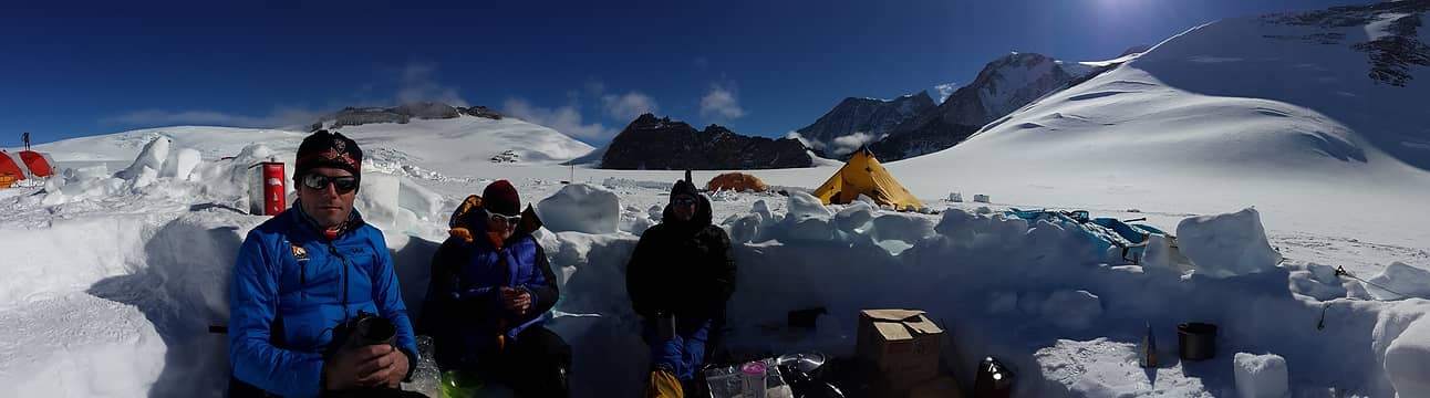 Basking in the warmth of the sun at our kitchen, before heading down to Vinson Base Camp. Photo by Ossy.