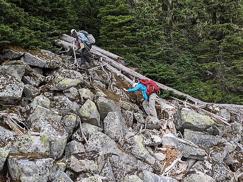 Descending boulders to Windy Lake after getting cliffed out on the ridge