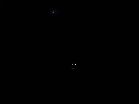 bad dog and cartman's headlamps with a faint moonlight above while on the road back to the car