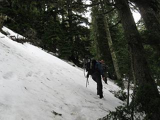 traversing steep slopes on the s. side of the w. ridge