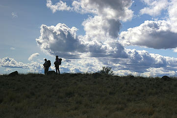 Hikers silhouetted against the sky at Steamboat Rock