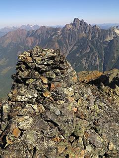 Summit cairn, with towers of Slesse behind