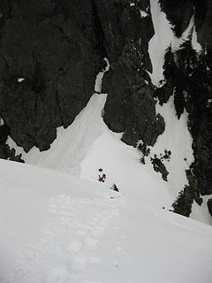 Looking back down the steep snow pitch to the notch.