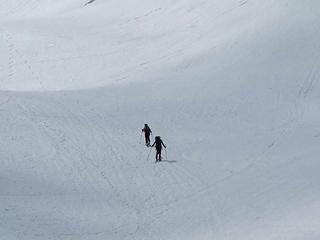 Two skiers heading up to Silver's Ridge