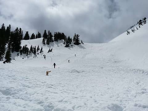 Heading up to the upper bowl - two skiers and hiker