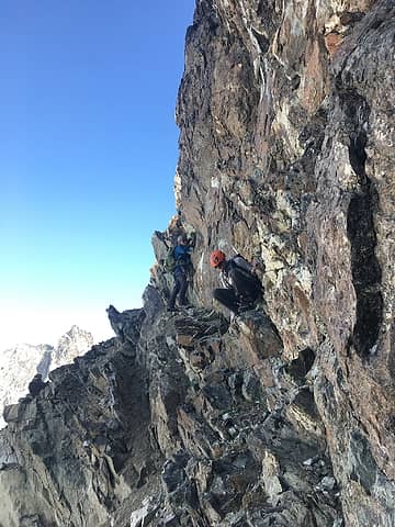 Jake and Fletcher feeling out the ledge on the southeast side below the Ridge of Gendarmes