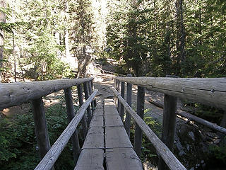 Big sturdy log bridge over Mountaineer Creek on Lake Stuart trail.