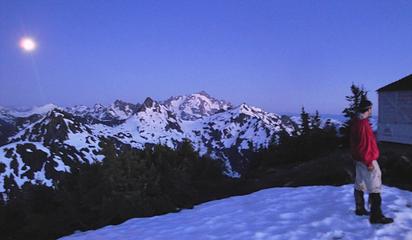 Gimpilator standing next to the Winchester Mountain lookout after sundown