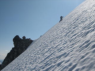 down climbing the steep snow