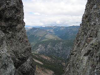 Peering through a gap below Three Pinnacles North