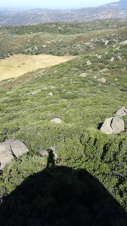 My shadow atop summit rock