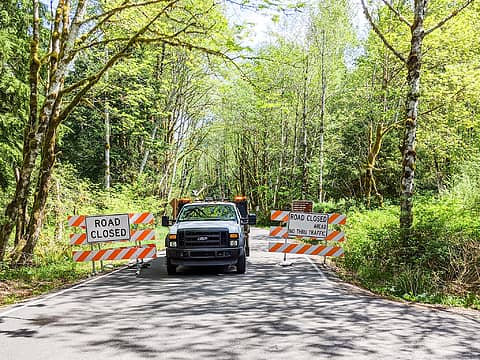 Closure at Mailbox trailhead. The King County vehicle is there to let construction vehicles through.