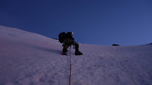 Luca ascending perfect snow slopes on the SW ridge
