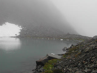 Lake at 6350 feet just below Cloudy Pass still mostly covered in snow and ice
