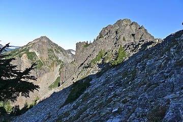 After crossing the ridge the route traverses and descends below the rock ribs.