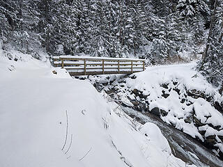 Mason Creek bridge with fresh snow. With the cold temperatures the water volume wasn't unusual, but when things warm up ...