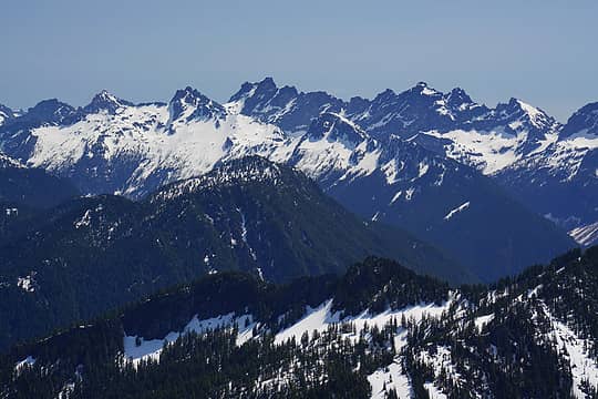 Burntboot Peak ridge in the center, with the Middle Fork Snoqualmie River drainage in front of it (and Price on the other side), and the Burtboot Creek drainage behind it, leading to Overcoat Peak. In the back is the ridge of Chimney Rock, Lemah, Chikamin