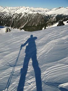 My shadow on the wind-carved snow