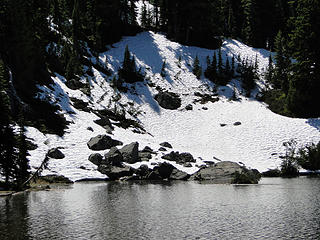 Upper Crystal Lake and snow still on rocks on far bank.