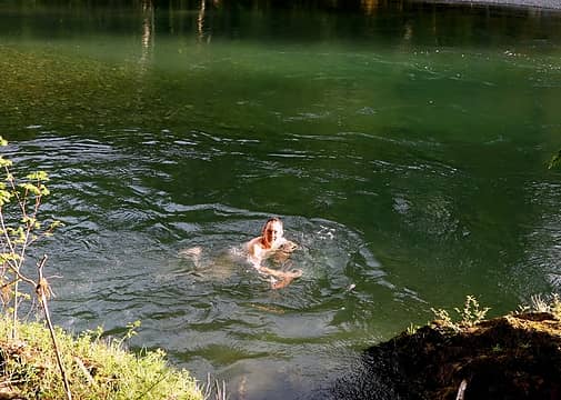 a refreshing swim in the clear green water