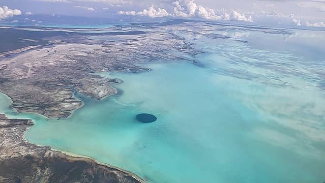 The Middle Caicos Blue Hole is likely the widest ocean hole on earth (seen during flight)