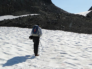 Thom crossing snow on trail to Panhandle Gap.