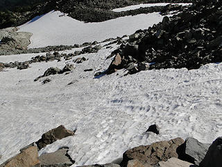First snowfield crossing on trail down from Knapsack Pass.