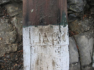 Initials inscribed into a piece of cedar siding that was on the lookout