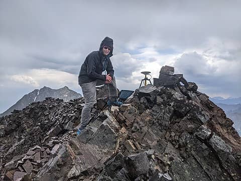 On the summit of Blackcap Mountain with the differential GPS unit, July 2023