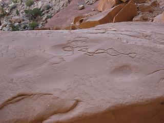 Petroglyph over metate
