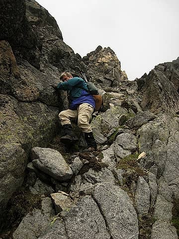 rodman climbing down the gully
