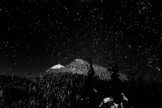 Gloriously starry sky above moonlit Groat Mtn