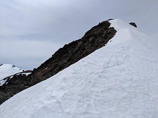 Heading up the spine of snow below the summit, the only place an ice axe seemed like a good idea