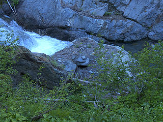 Close up of cairn marking the beginning of the gorge bypass trail for travelers heading out the Elwha/Quinault