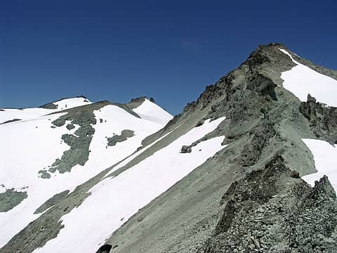 A little more ridge, then drop down and traverse across the South side of the East summit and up the gulley between E and W summits.