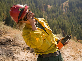 Trinity Ridge (West) Fire, Idaho City, Idaho, Boise National Forest, August, 2012; Black Mountain Hotshots; using a signal mirror to flash the pilot to locate sling site