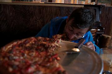 Rogier digging into a 17 inch pizza at the Prospector ("49 beers on tap":)