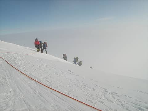 Climbers reaching the top of the fixed lines.