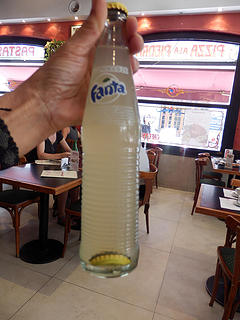 see the bottle cap inside the unopened bottle of Fanta?