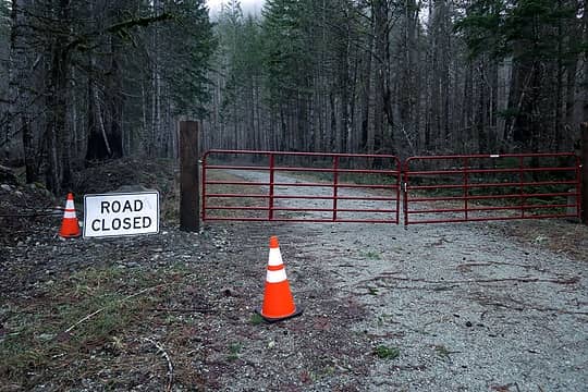 Closed gate and burned forest on Newhalem Creek Road