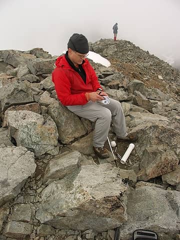Steve P. makes his mark on the northwest and the summit register.