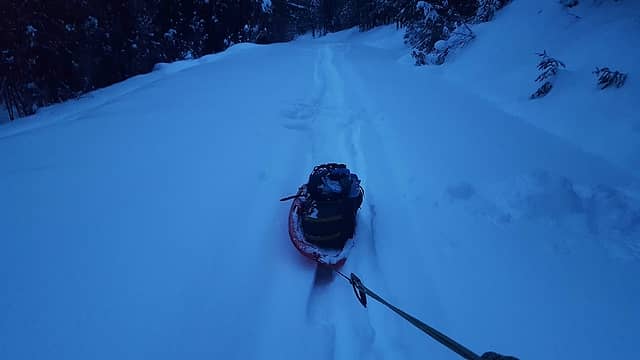 Towing the sled near sunrise