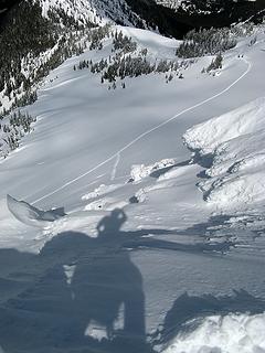 My shadow looking back down at some skiers standing where our group separated