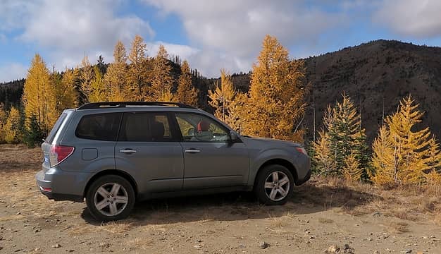 My car at the Pyramid Mtn trailhead, with Crow Hill shaded in the background.